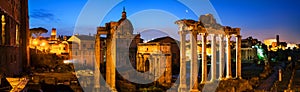 Aerial view of illuminated Roman forum in Rome, Italy at night