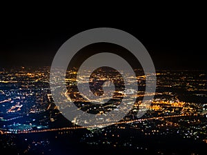 Aerial view illuminated suburbs of city at night