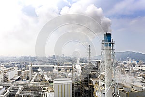 Aerial view of industrial area with chemical plant. Smoking chimney from factory