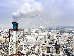 Aerial view of industrial area with chemical plant. Smoking chimney from factory