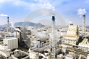 Aerial view of industrial area with chemical plant. Smoking chimney from factory