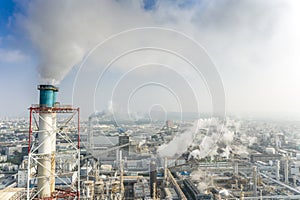 Aerial view of industrial area with chemical plant. Smoking chimney from factory