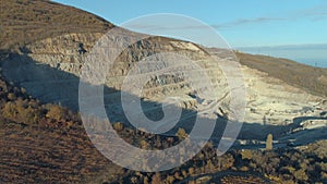 Aerial view industrial of chalk quarry. Shot. Lots of workers and machineries