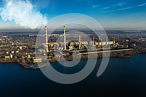 Aerial view of the Industrial Garbage Plant with Smoking White Pipes in the City. Industrial zone. Atmosphere