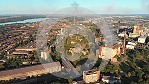 Aerial view of the Industrial Plant with Smoking Pipes near the City. Industrial zone