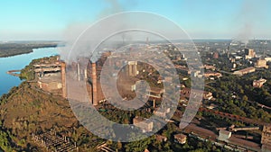 Aerial view of the Industrial Plant with Smoking Pipes near the City. Industrial zone