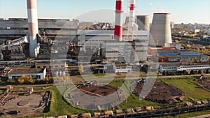 Aerial view of the Industrial Plant with Smoking Pipes near the City. Industrial zone. View from the drone to the