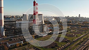 Aerial view of the Industrial Plant with Smoking Pipes near the City. Industrial zone. View from the drone to the