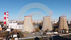 Aerial view of the Industrial Plant with Smoking Pipes near the City. Industrial zone. View from the drone to the