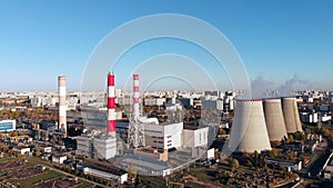 Aerial view of the Industrial Plant with Smoking Pipes near the City. Industrial zone. View from the drone to the