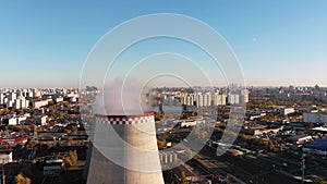 Aerial view of the Industrial Plant with Smoking Pipes near the City. Industrial zone. View from the drone to the