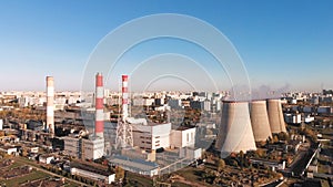 Aerial view of the Industrial Plant with Smoking Pipes near the City. Industrial zone. View from the drone to the