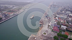 Aerial view of an industrial seaport in northern Italy. Constructions, technologies and infrastructure of a port.