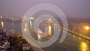 Aerial view of an industrial seaport in northern Italy. Constructions, technologies and infrastructure of a port.