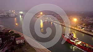 Aerial view of an industrial seaport in northern Italy. Constructions, technologies and infrastructure of a port.