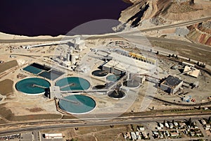 An aerial view industrial water treatment at an open pit copper mine.