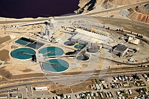 An aerial view industrial water treatment at an open pit copper mine.