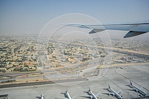 Aerial view from inside the plane flying over Dubai