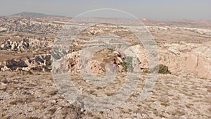 Aerial view Inspired athlete woman stand on top mountain enjoy panorama outdoors determined