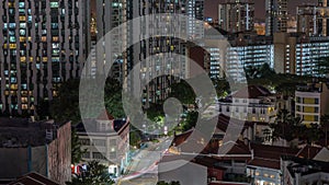 Aerial view of intersection and art deco shophouses along Neil road in Chinatown area night timelapse