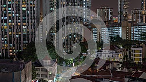 Aerial view of intersection and art deco shophouses along Neil road in Chinatown area night timelapse