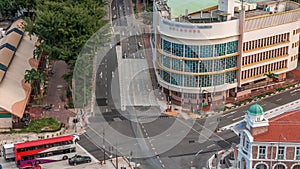 Aerial view of intersection and art deco shophouses along Neil road in Chinatown area timelapse