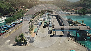 Aerial View of Island Harbor Port with many Trucks