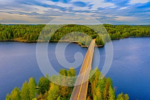 Aerial view of the island of Rapeikko and Ihantsalo on a blue lake Saimaa. Landscape with drone. Blue lakes, islands and green