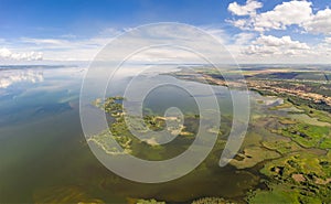 Aerial view of islands with lush greenery in a freshwater river in summer. European landscape