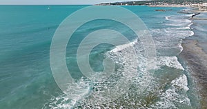 Aerial view of Italian coast, flying above waves in Mediterranean sea