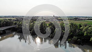 Aerial view with an Italian village located on the bank of a river.