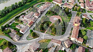 Aerial view with an Italian village located on the bank of a river.