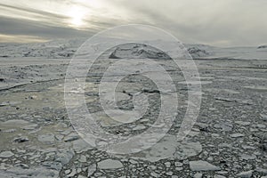 Aerial view of the J kuls rl n glacial lagoon and floating icebergs. The beginning of spring in Iceland