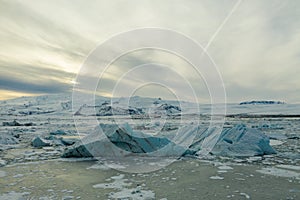 Aerial view of the J kuls rl n glacial lagoon and floating icebergs. The beginning of spring in Iceland