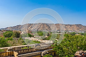 Aerial view of Jaipur cityscape from the Hawa Mahal ` Palace of the winds and Jaigarh Fort on hilltop