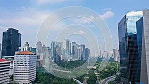 Aerial View of Jakarta Downtown Skyline with High-Rise Buildings at Noon