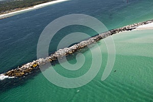 Aerial view of jetty along the coastline of Panama City, Florida