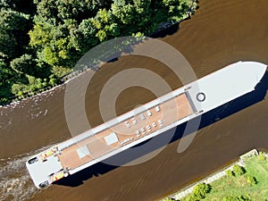 Aerial view journey by passenger cruise ship on the river. Beautiful panoramic landscape from a height ship sails along a river