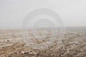 Aerial view of the Judean desert located on the West Bank of the Jordan river. Deserted shore of dead sea. The background of