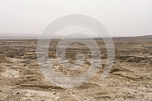 Aerial view of the Judean desert located on the West Bank of the Jordan river. Deserted shore of dead sea. The background of