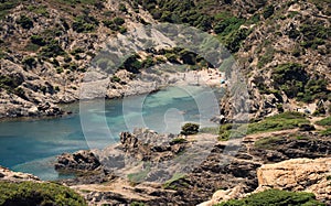 Aerial view of Jugador cove rocky beach surrounded by emerald water in Cap de Creus photo