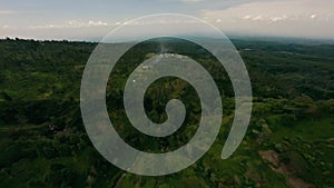 Aerial view jungle village canyon active volcano eruption smoke stream disaster