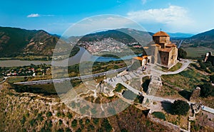 Aerial view of Jvari clifftop orthodox monastery located in Mtskheta Georgia. Summer sunny day. Travel and vacation concept. Wide