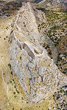 Aerial view of Kahta Castle, Kalesi. The Yeni Kale Fortress in Eski Kahta is perched atop a hill with a steep slope. Turkey