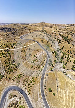Aerial view of Kahta Sincik Road, close to Katha river near the village of Taslica, Adiyaman Province, Turkey. Winding roads