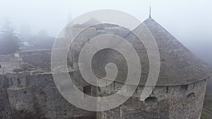 Aerial view of Kamianets-Podilskyi castle in Ukraine under the mist