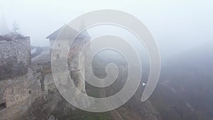 Aerial view of Kamianets-Podilskyi castle in Ukraine under the mist.