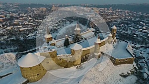 Aerial view of Kamianets-Podilskyi castle in Ukraine in winter. The fortress located among the picturesque nature in the