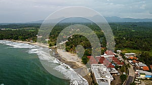 Aerial view of Karang Bolong Beach and Its Wonderful Sunset View. At anyer beach with noise cloud and cityscape. Banten, Indonesia