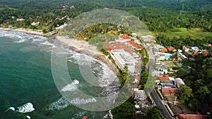 Aerial view of Karang Bolong Beach and Its Wonderful Sunset View. At anyer beach with noise cloud and cityscape. Banten, Indonesia